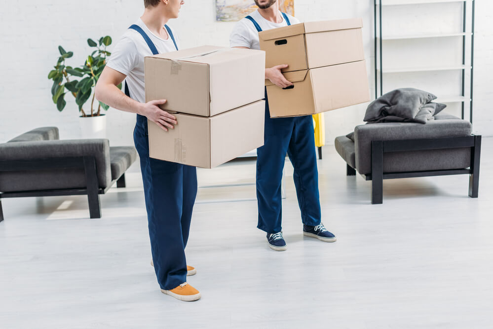 Athens Moving Experts carrying boxes