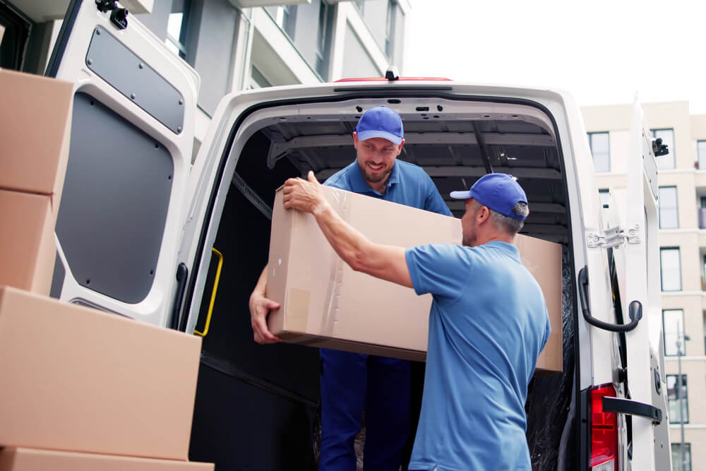 Birmingham movers placing a box in a van
