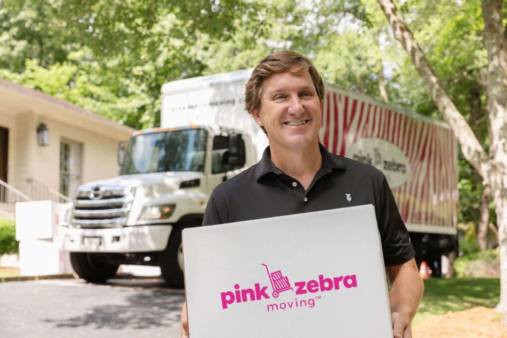 Pink Zebra mover in Hamilton Indiana holding a box