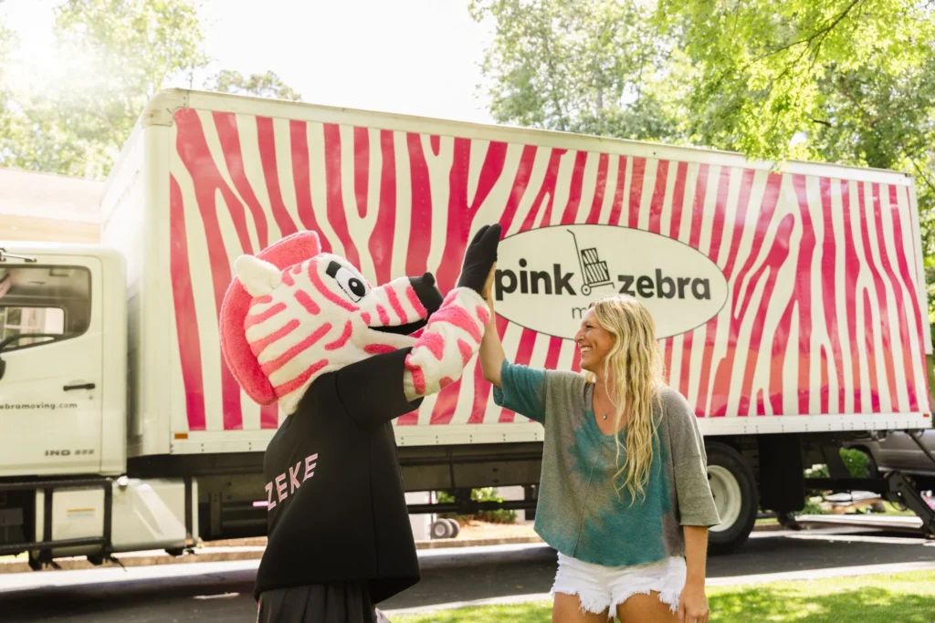 movers in plano tx zebra-mascot customer high five