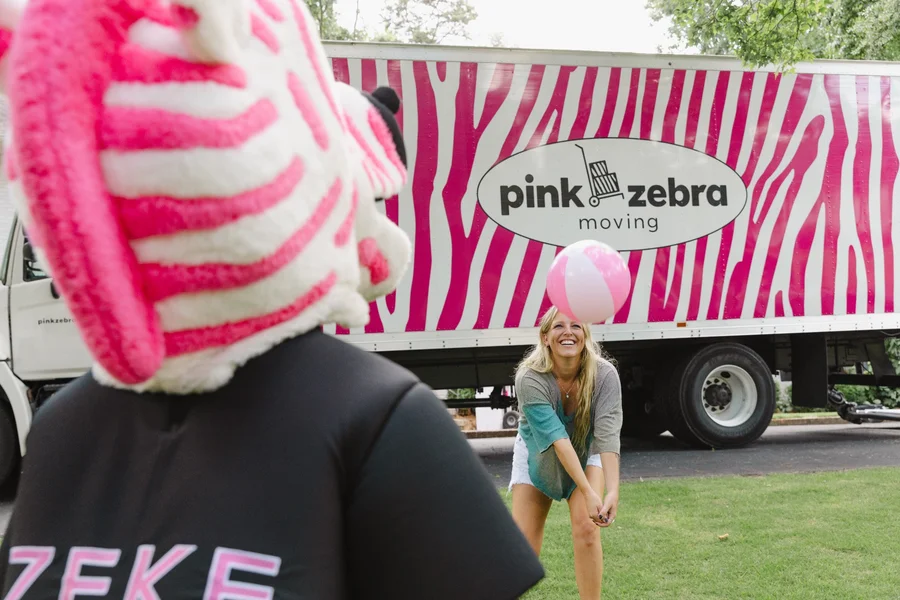 pink-zebra-mascot-with-moving-truck-lake-norman-moving-companies