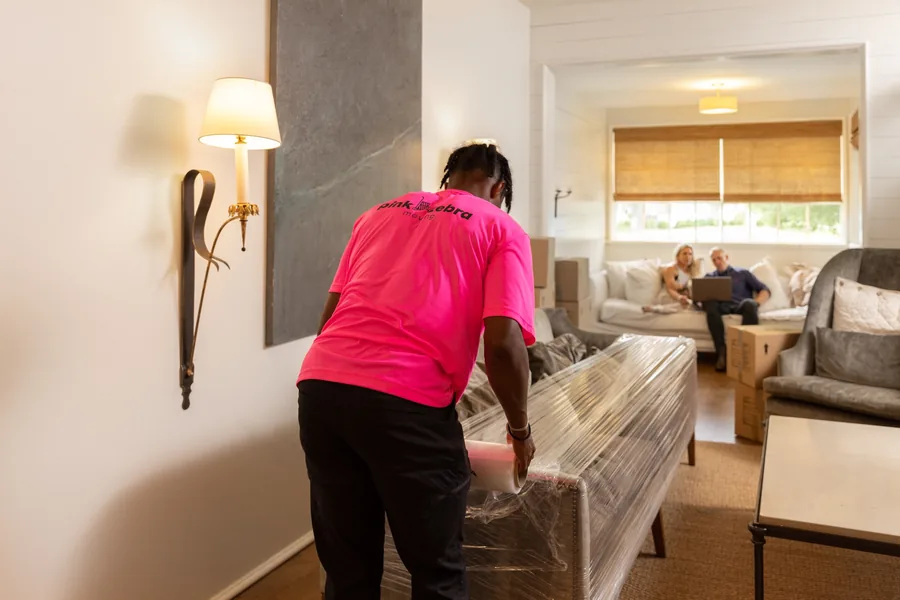 professional movers wrapping furniture for a safe move in oklahoma city ok