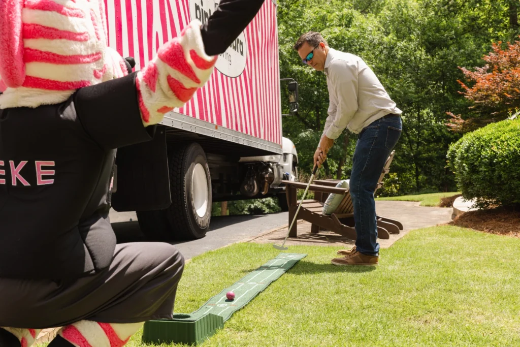 salt lake city movers backyard golf loading scene mascot truck