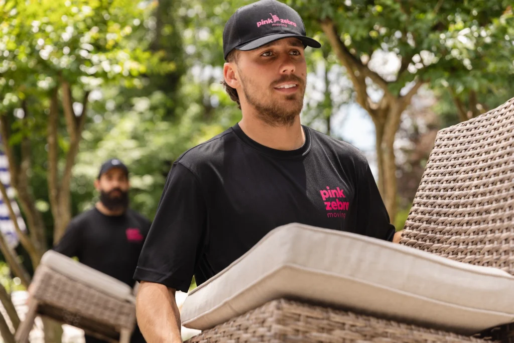 salt lake city movers close up carrying wicker furniture outdoor