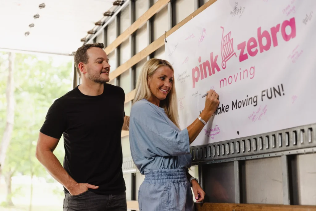 tampa movers carrying boxes customer smiling residential move