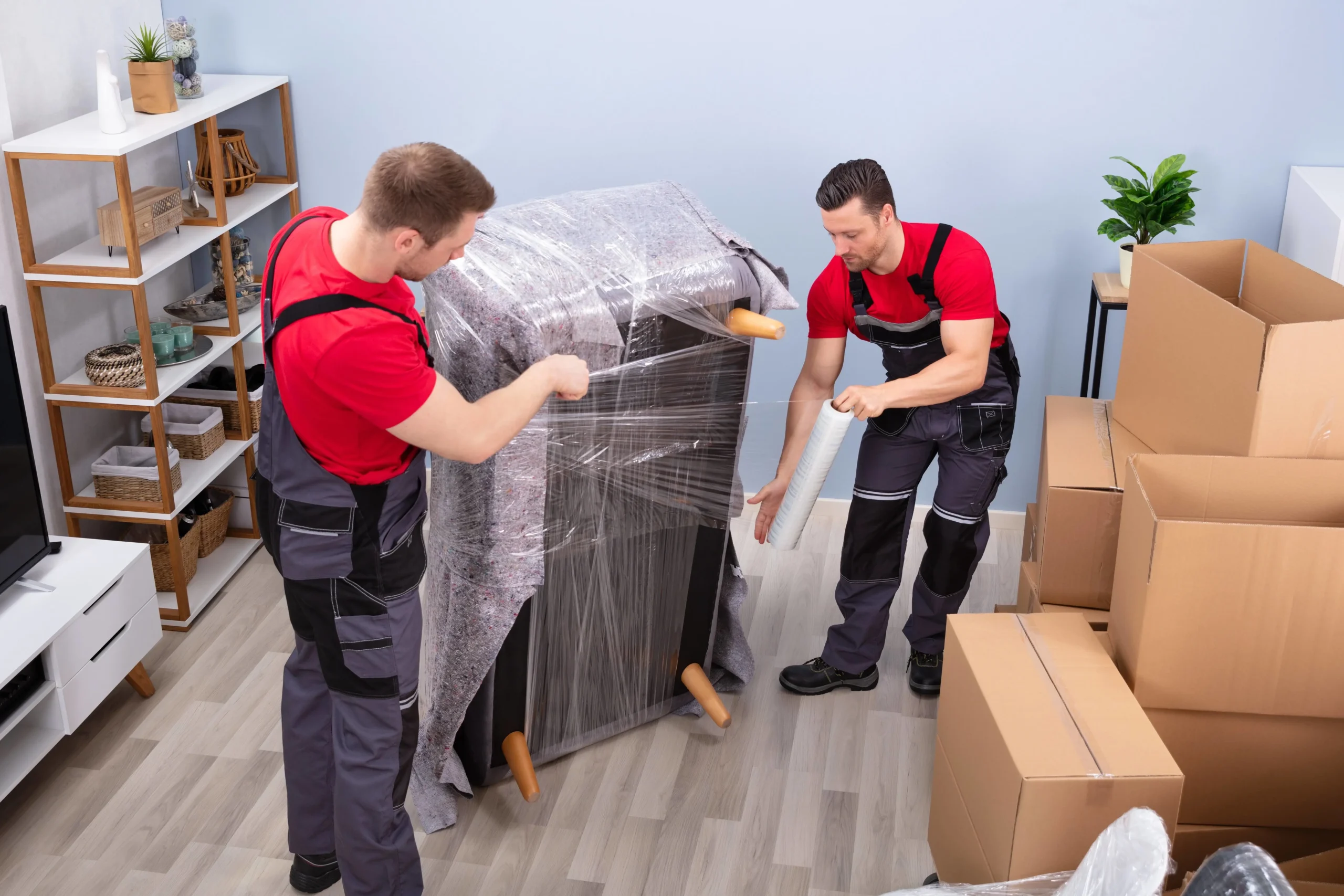 unpacking a sofa by two men from expert moving companies wilmington nc
